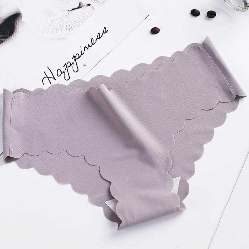 Solid color low waist ruffle stretch briefs, seamless and feminine, with delicate detailing for comfort and style. Soft cotton-silk blend.